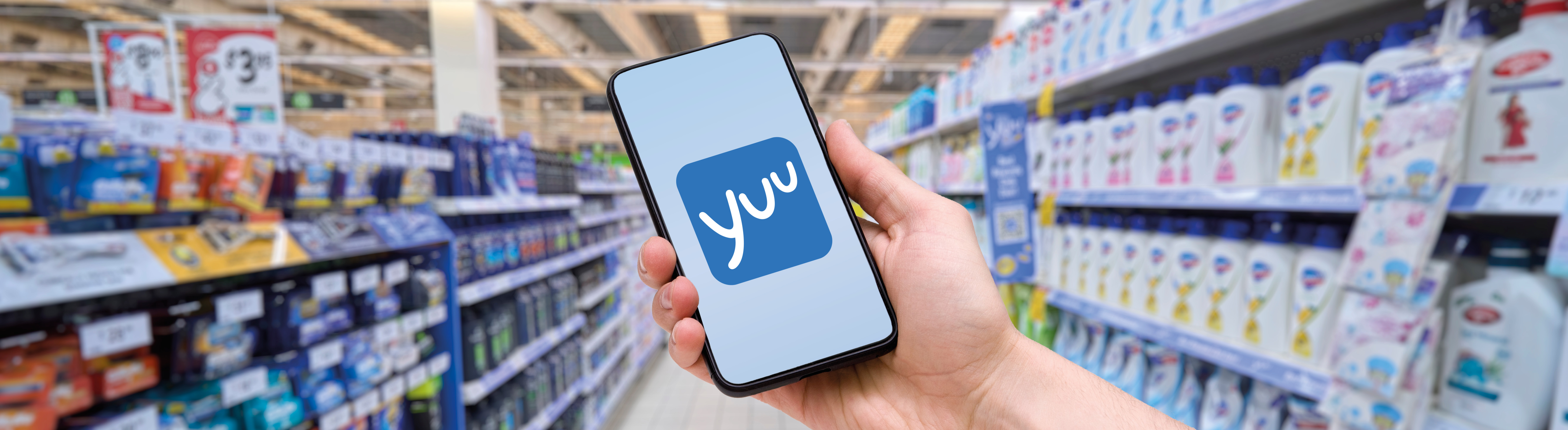 Hand holding a mobile with Yuu logo in display