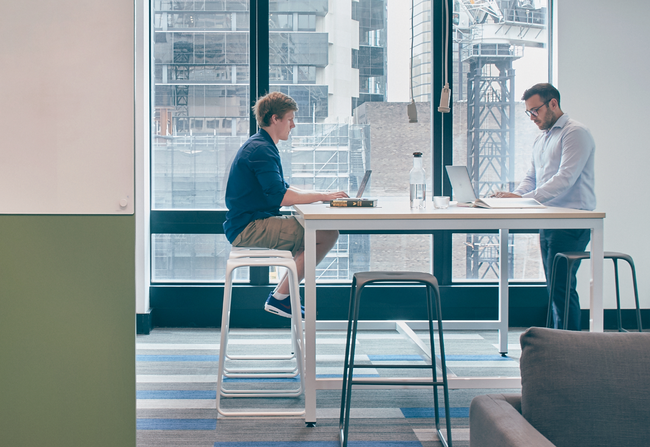 Thoughtworkers working together at a desk