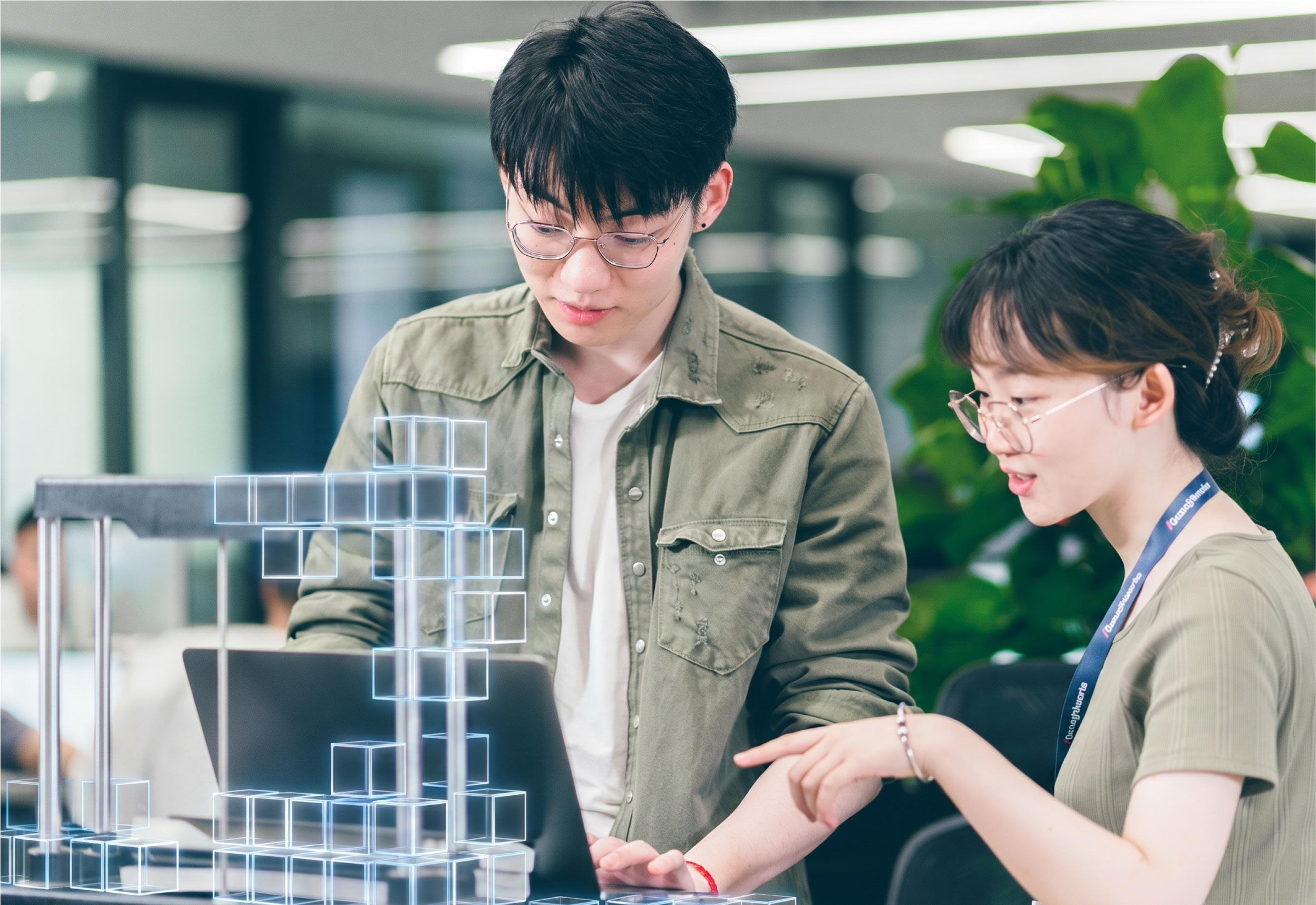 Photo of two Chinese Thoughtworkers, both wearing glasses, in a discussion at a laptop, AI cubes are building something out of the machine.