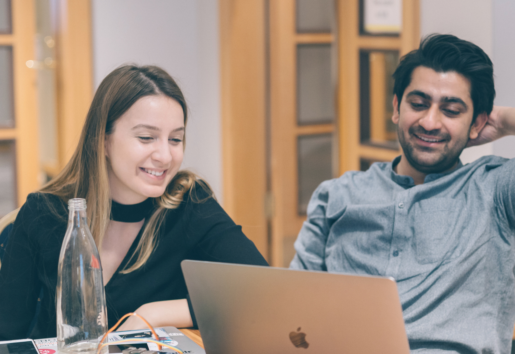 Large group of happy Thoughtworkers laughing and celebrating