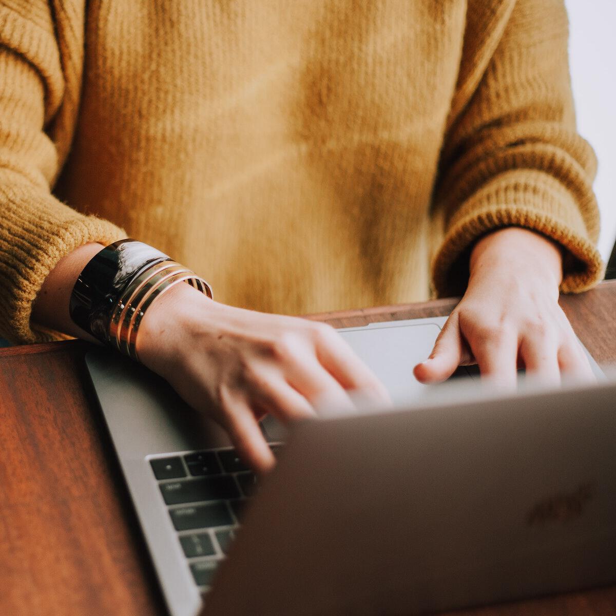 Remote work playbook Image of woman working at laptop