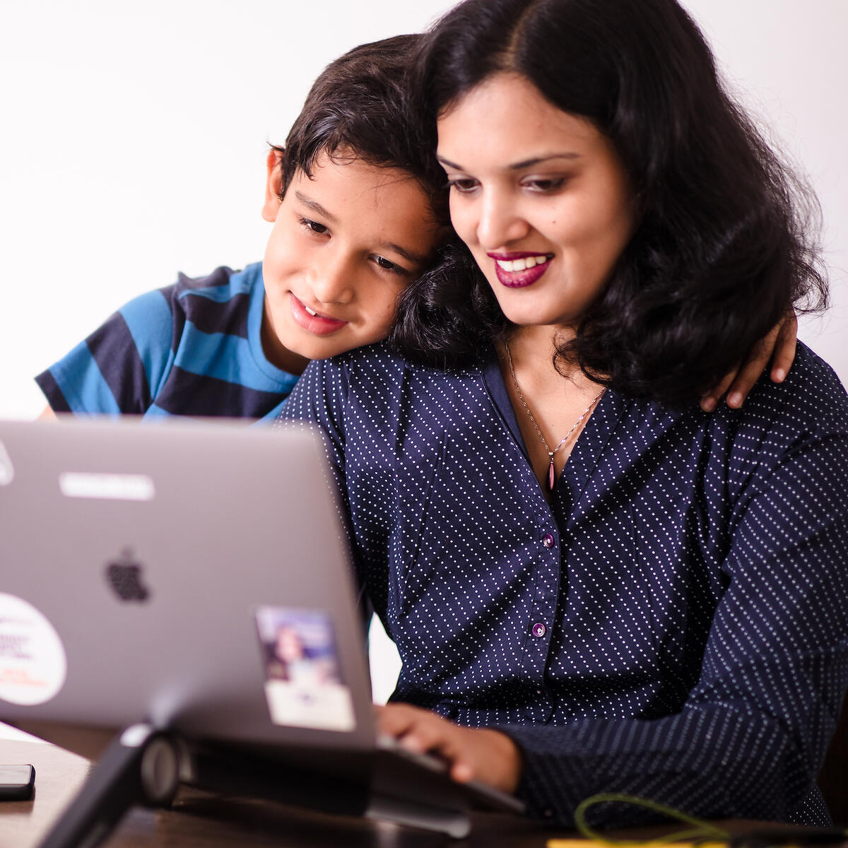 Image of Thoughtworker and her son at work