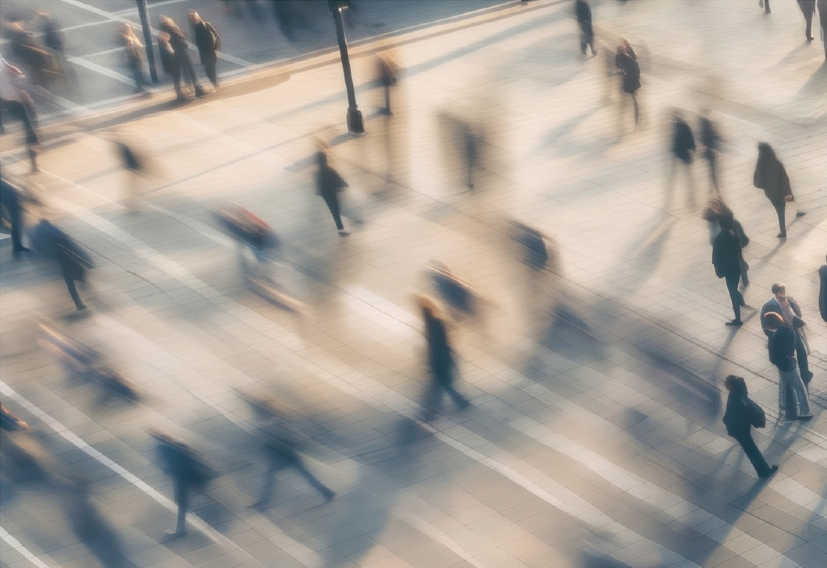 Long exposure image showing people crossing a busy junction