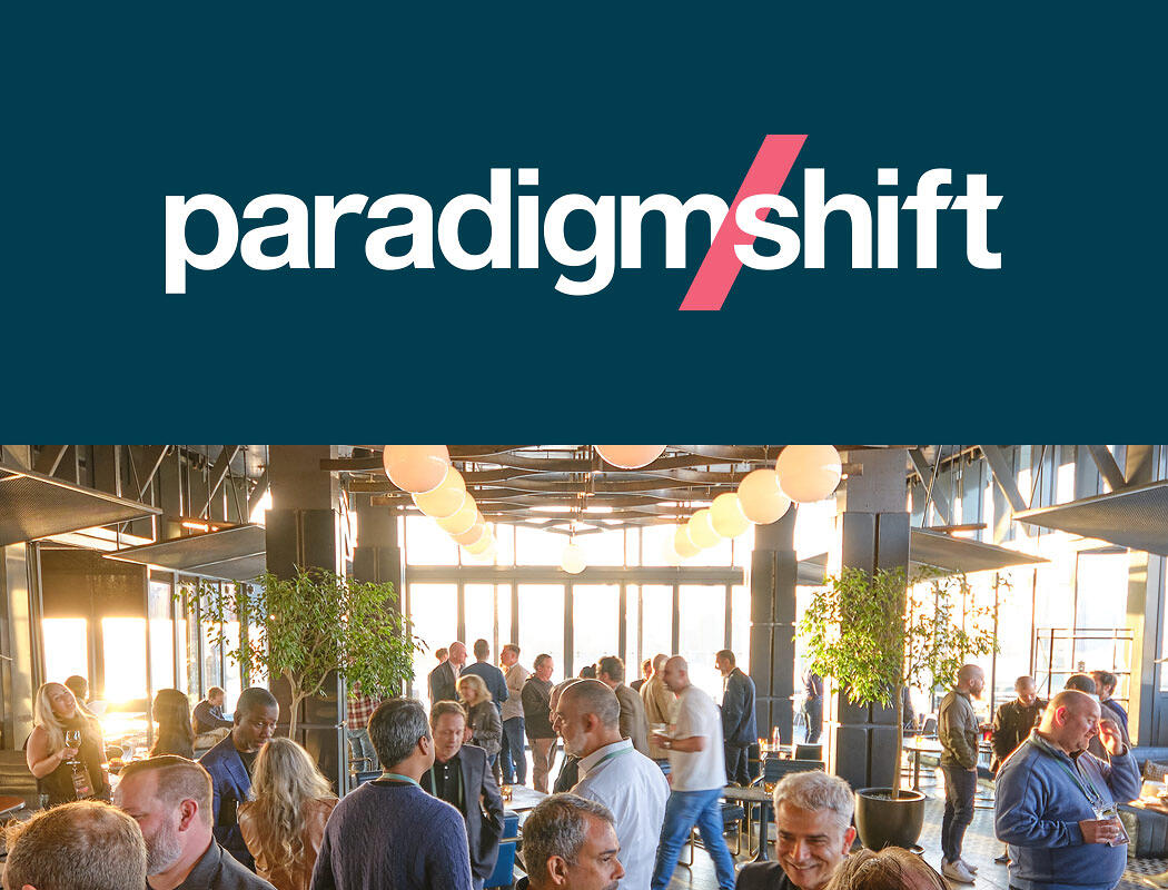 Paradigm Shift logo above a photo of guests enjoying the sunset from atop the William Vale Hotel.