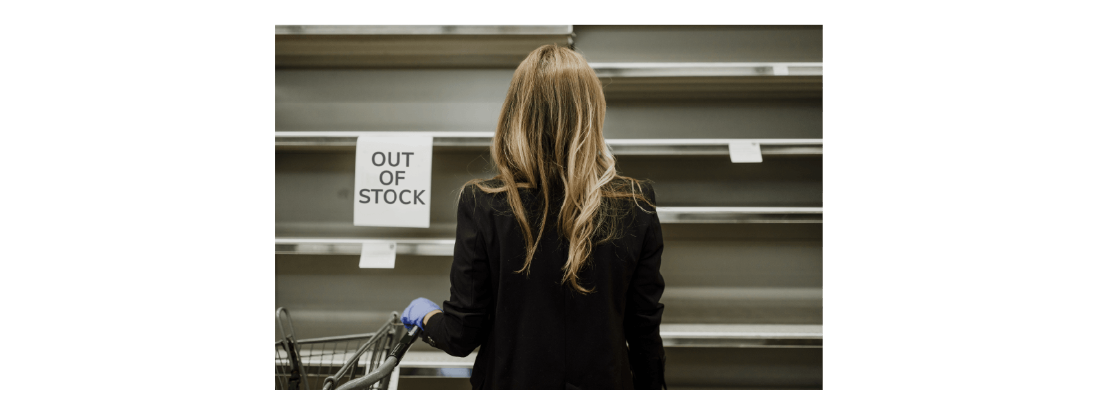 building-resilience-in-the-retail-supply-chain Lady looking at 'Out of Stock' shelves