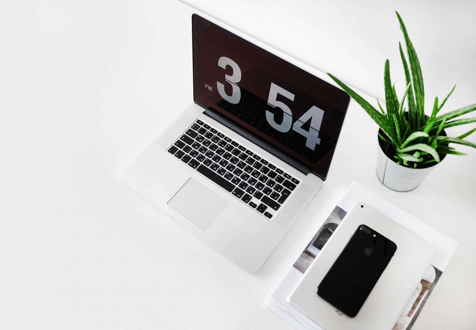 Laptop with showing time.