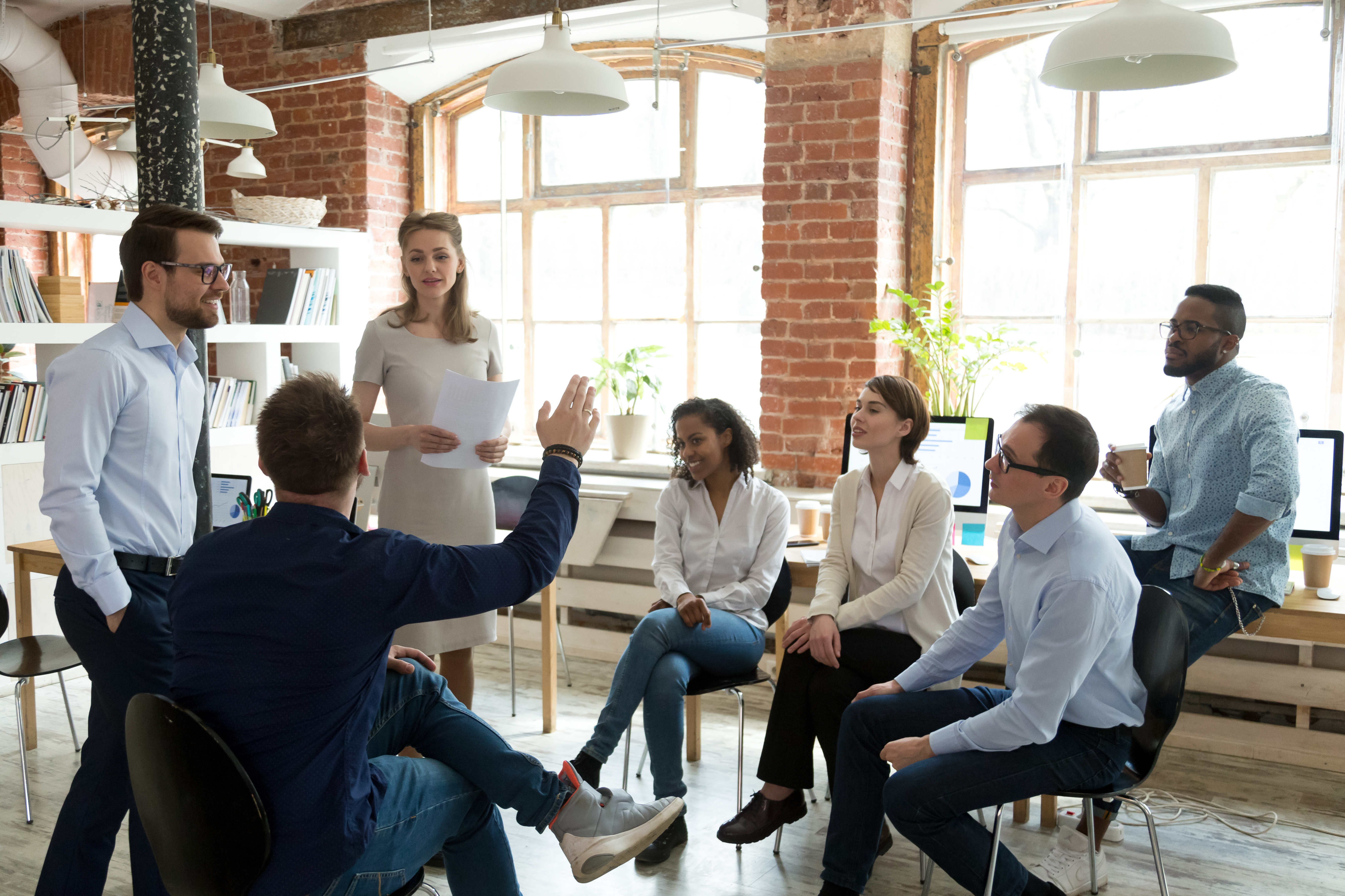 People in a stand up meeting People in a stand up meeting
