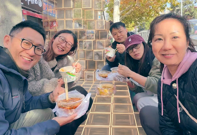 Jessie with the team having local breakfast.