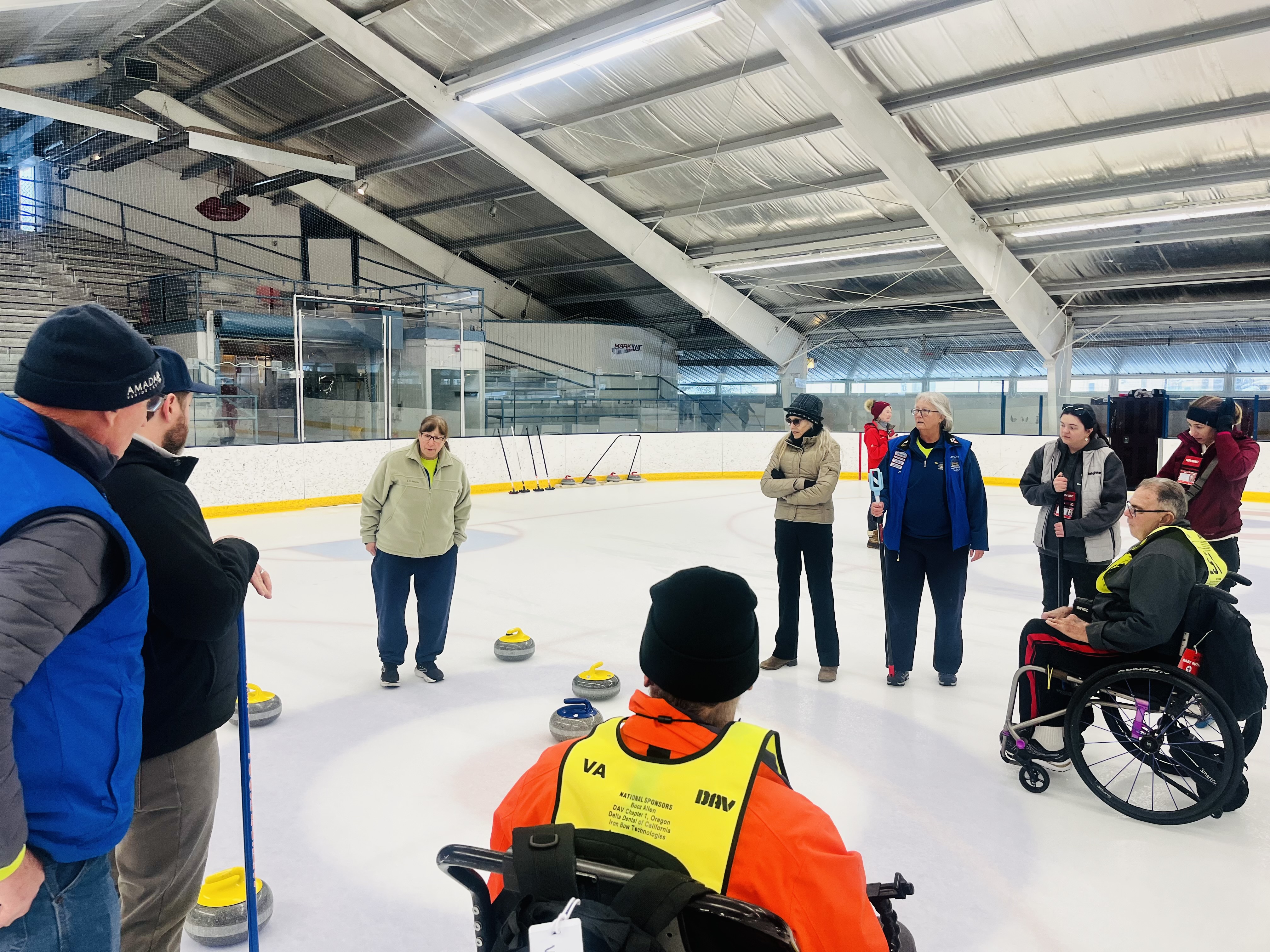 Image of Veterans playing a game of curling at the 39th Winter Sports Clinic