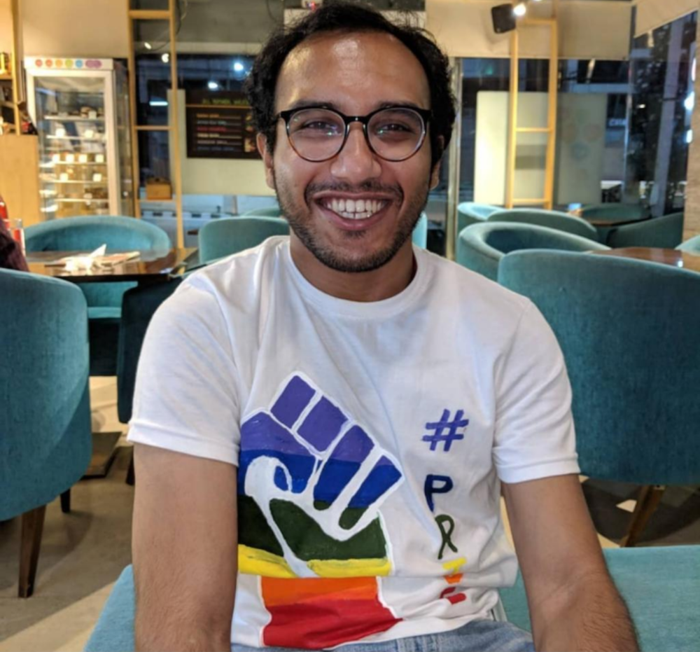 karthik in a pride t shirt