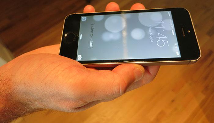 The ever-popular iPhone by Apple  hand holding the Apple iphone