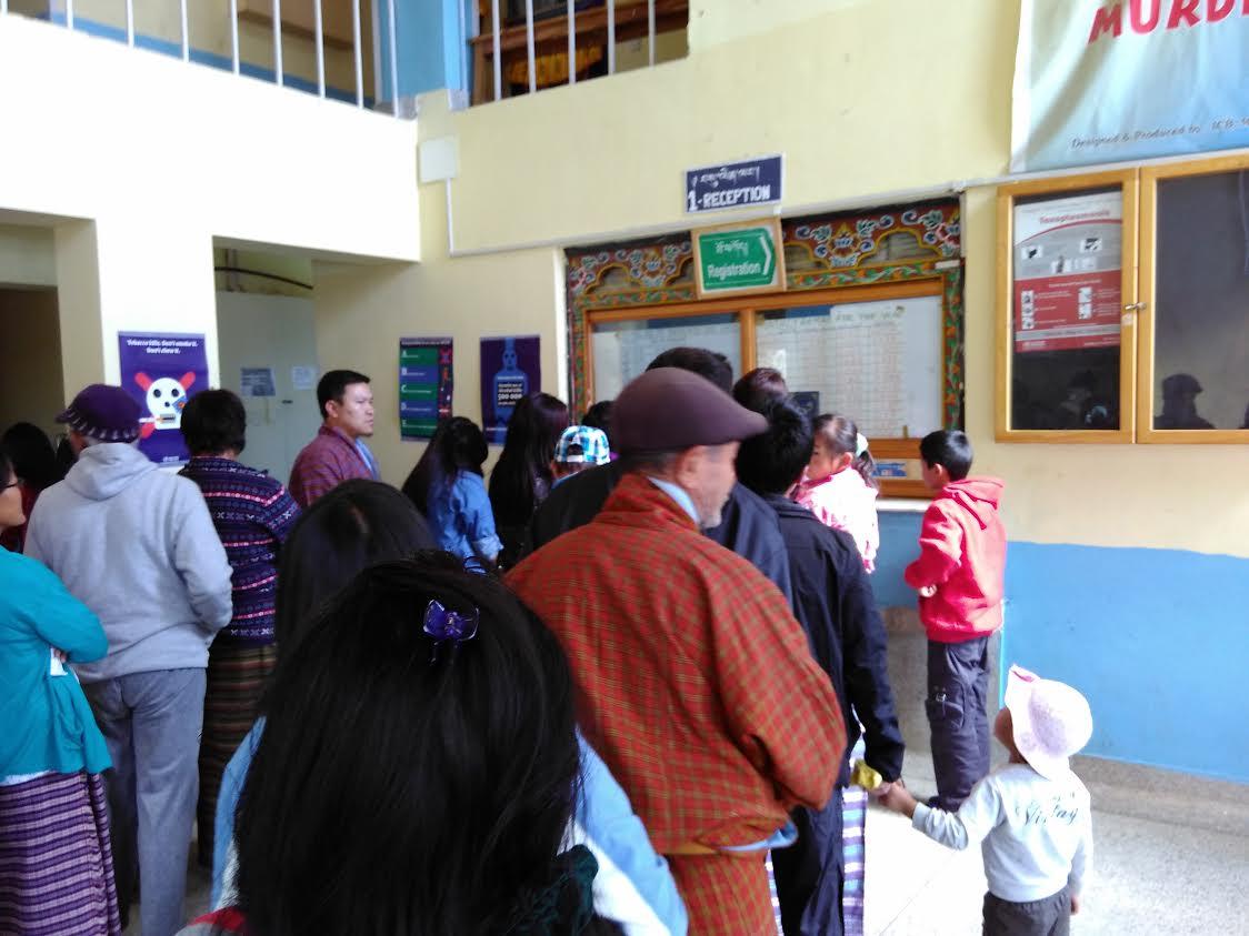 Observing the process flow from patient and registration clerk perspectives at Paro District Hospital.