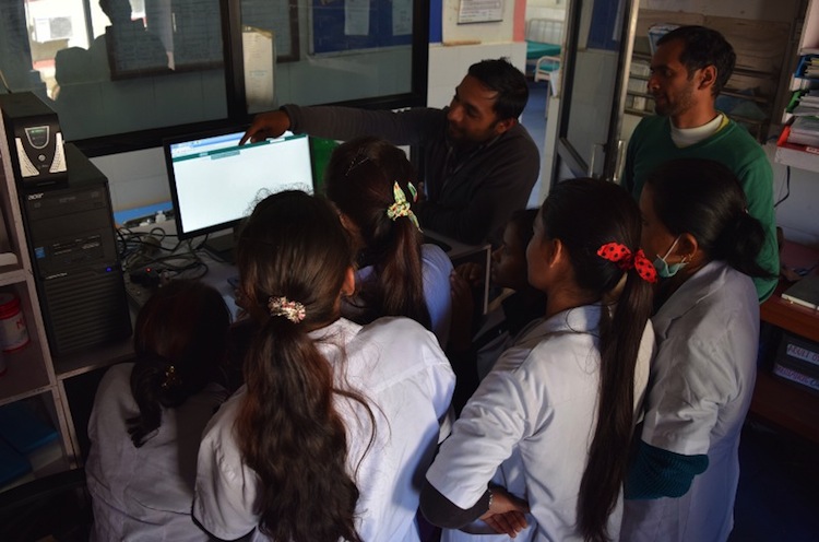 Our engineer, Anant, conducting EMR trainings with our nurses. Photo Credit: Possible