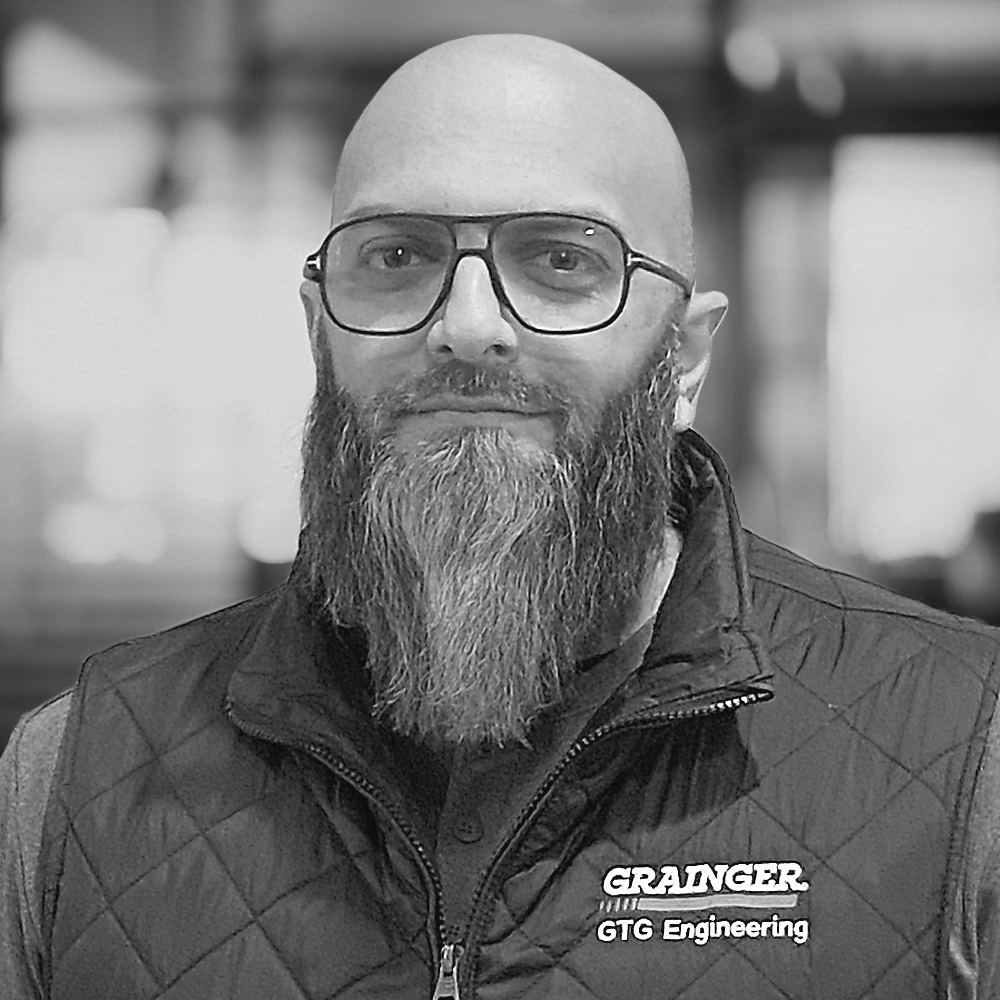 Anaf Durrani wearing glasses and a large beard.