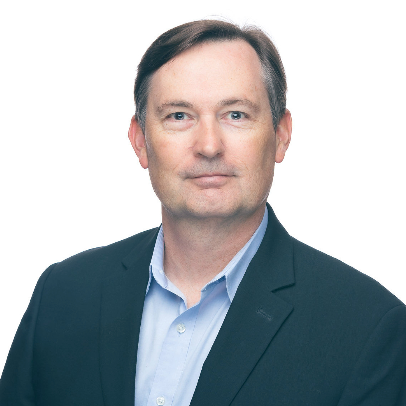 Man with brown hair in suit jacket