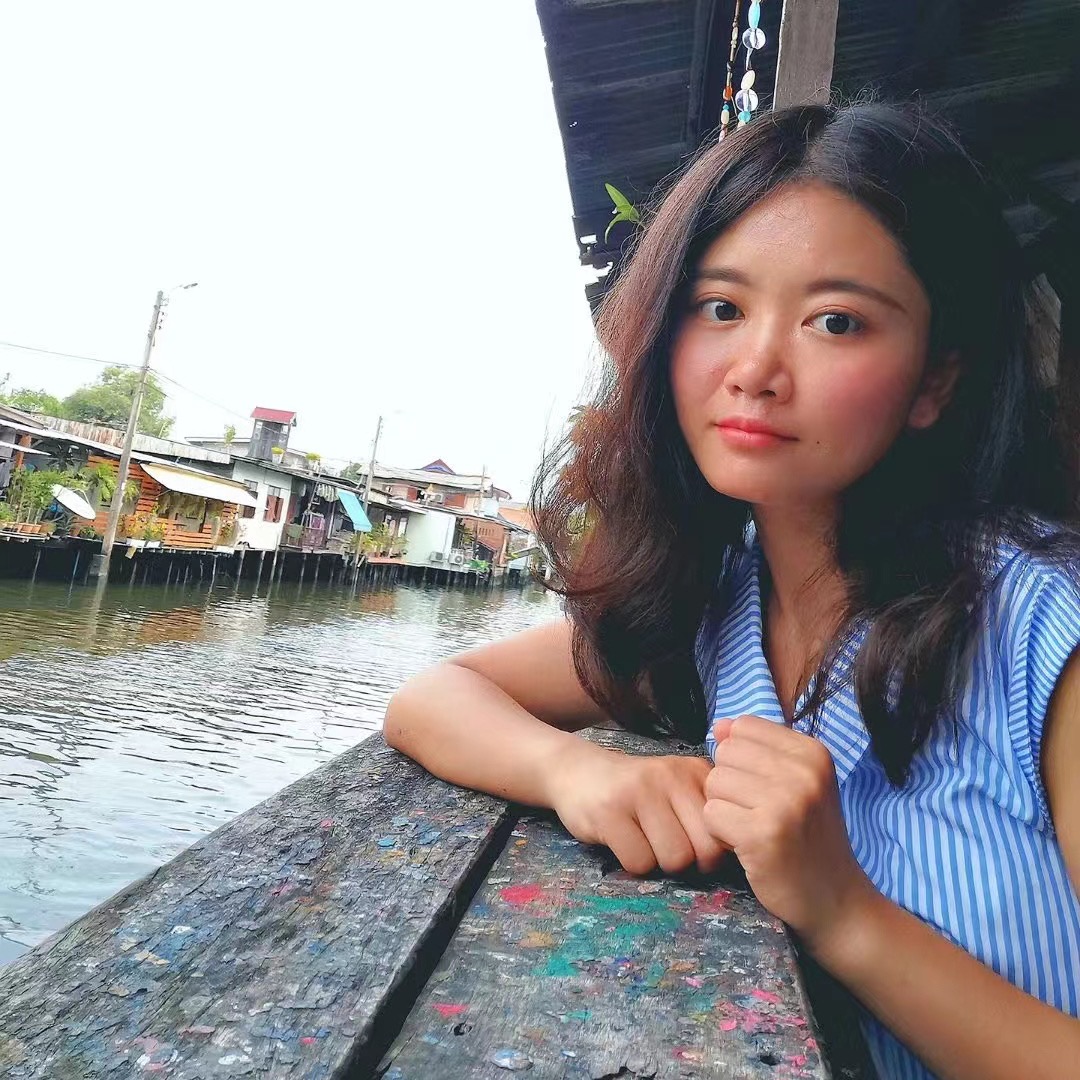 Image of Huanyu Zhou in front of a canal