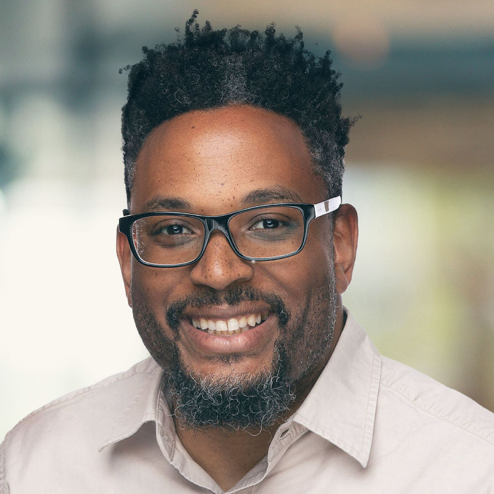 Photograph of Chad smiling, looking directly at the camera