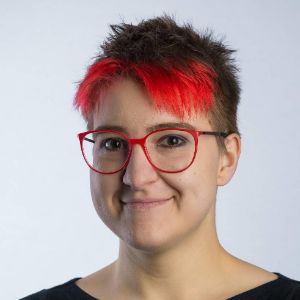 Masha Budryte Masha Budryte smiling, with red hair and glasses