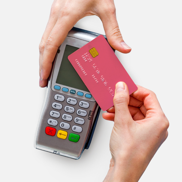 A person using contactless credit card on a card machine
